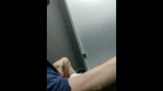 Jerking of in public restroom with people at the door and cumming on the floor
