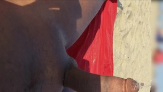 Big dick guy showing off cock on the nude beach